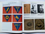an open book with a picture of military insignia on it