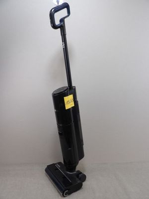 une image d'un aspirateur posé sur un support