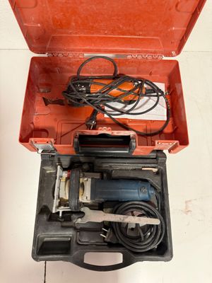 a tool in the case that is open on the floor