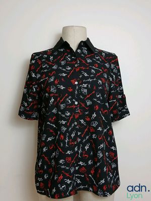 a black shirt with a red and white pattern on it