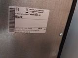 a close up of a metal box with a label on it