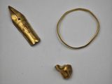 a close up of a gold ring, a gold ring, and a gold ring