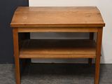 a small wooden table with a shelf underneath it