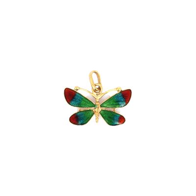 un gros plan d'un pendentif en forme de papillon sur fond blanc