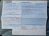 a receipt on the back of a pair of jeans