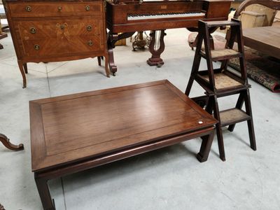 several pieces of furniture are sitting in a room with a piano