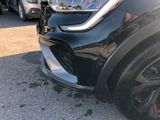a close up of the front end of a black car