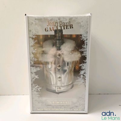 the box is open to show the contents of a bottle of jean paul gauttier