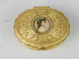 a gold box with a picture of a woman on it
