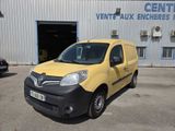 the yellow van is parked in front of the building