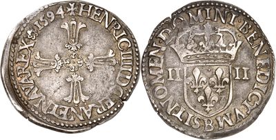 une pièce d'argent surmontée d'une couronne