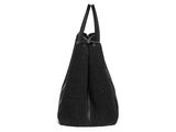 the large black bag is sitting on a white surface