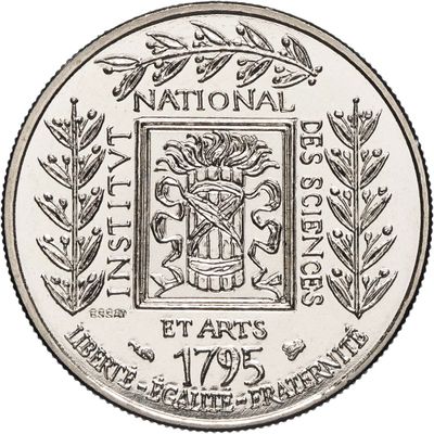 un gros plan d'une pièce de monnaie sur laquelle figure un blason