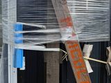 a pile of plastic wrapped up on the side of a building