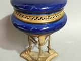 an image of a blue and gold jewelry box on a stand