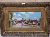 un tableau représentant un village avec une rivière au premier plan