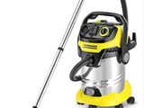 a yellow and black vacuum cleaner with a hose on a white background