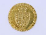 l'image d'une pièce d'or sur laquelle figurent des armoiries
