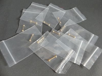 a lot of small bags with pins in them