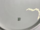 a white plate with a black and white design on it