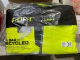 a bag of recycled clothing on a shelf in a store