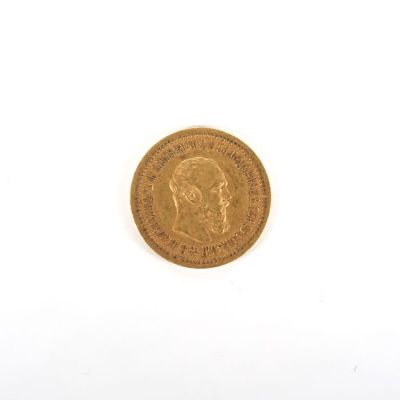 une image d'une pièce d'or sur une surface blanche