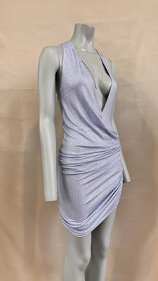 the mannequin is wearing a purple dress with a v - neck