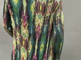 an image of a mannequin wearing a tie dye shirt