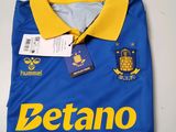 a close up of a blue and yellow shirt with a tag on it