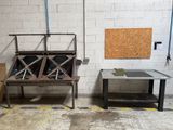 two tables and a bench in a room with a brick wall