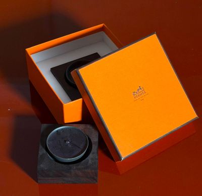 an orange box that has a watch inside of it