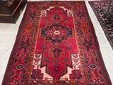 a rug on the floor in the middle of a room