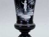 black and white picture of a vase with a child on it