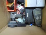 a box full of assorted electronics and other items