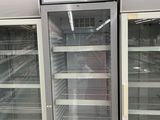 two empty refrigerators that are in a store