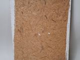 a picture of a piece of cardboard with a tag on it