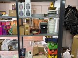 many boxes and boxes on the shelves in the room