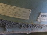 a label on the back of a machine that is sitting on a table