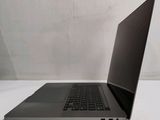 an open laptop computer sitting on top of a white table