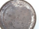 an old frying pan with the word eagle written on it