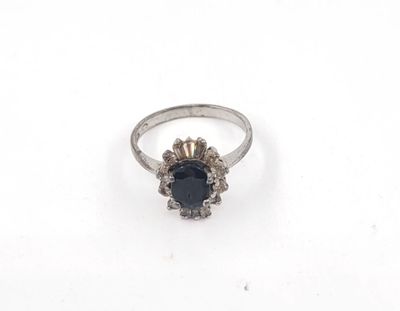 a close up of a ring on a white surface