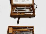 two different types of tools in a wooden case