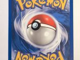 a close up of a pokemon card on a white surface