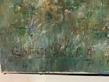 a painting hanging on the wall of a room