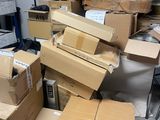 many boxes stacked on top of each other in a room