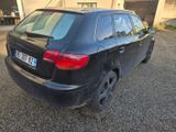 a black car that is parked in a parking lot