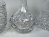 three glass vases sitting on a table next to each other