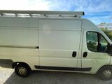 a white van that is parked in the parking lot