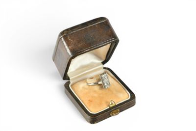 a ring in a ring box on a white surface