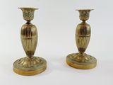 pair of antique brass candlesticks on marble bases